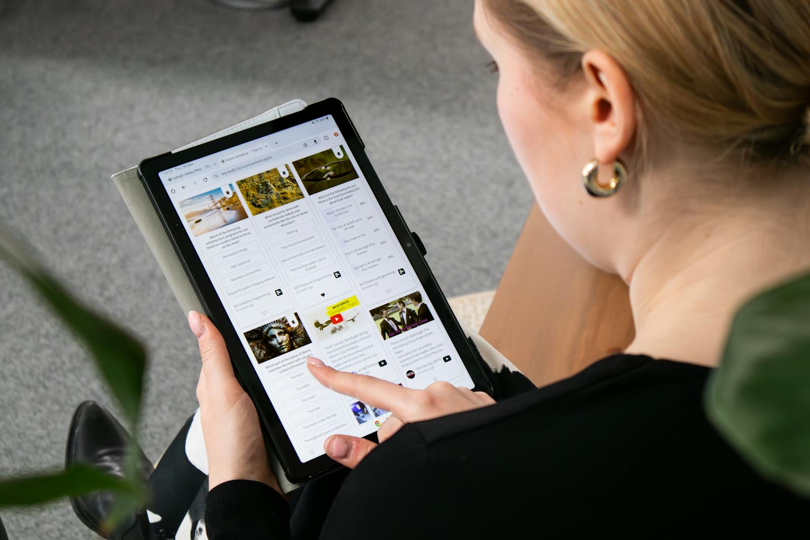 A lady selecting a news article based on the title and image