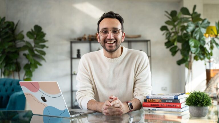 Ali Abdaal at his desk