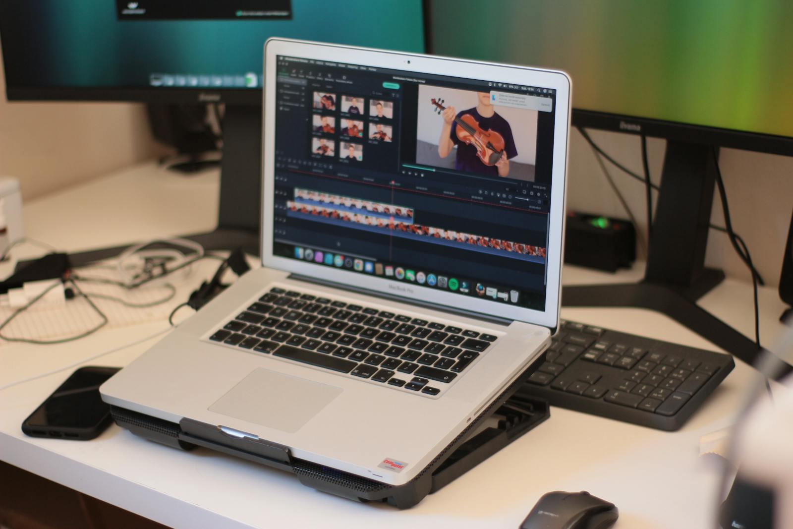 A video editing workstation set up with someone editing in jump cuts for a better viewing experience