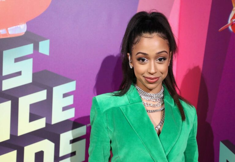 Liza Koshy posing at an event