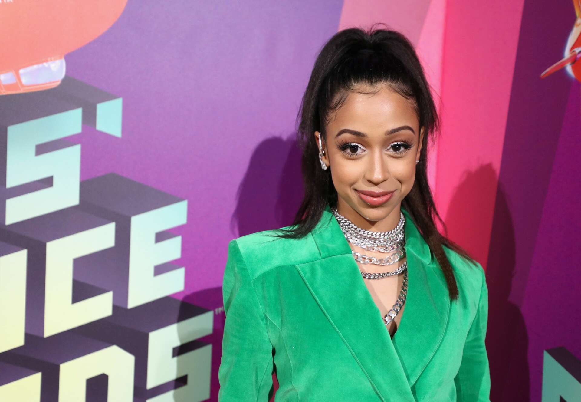 Liza Koshy posing at an event